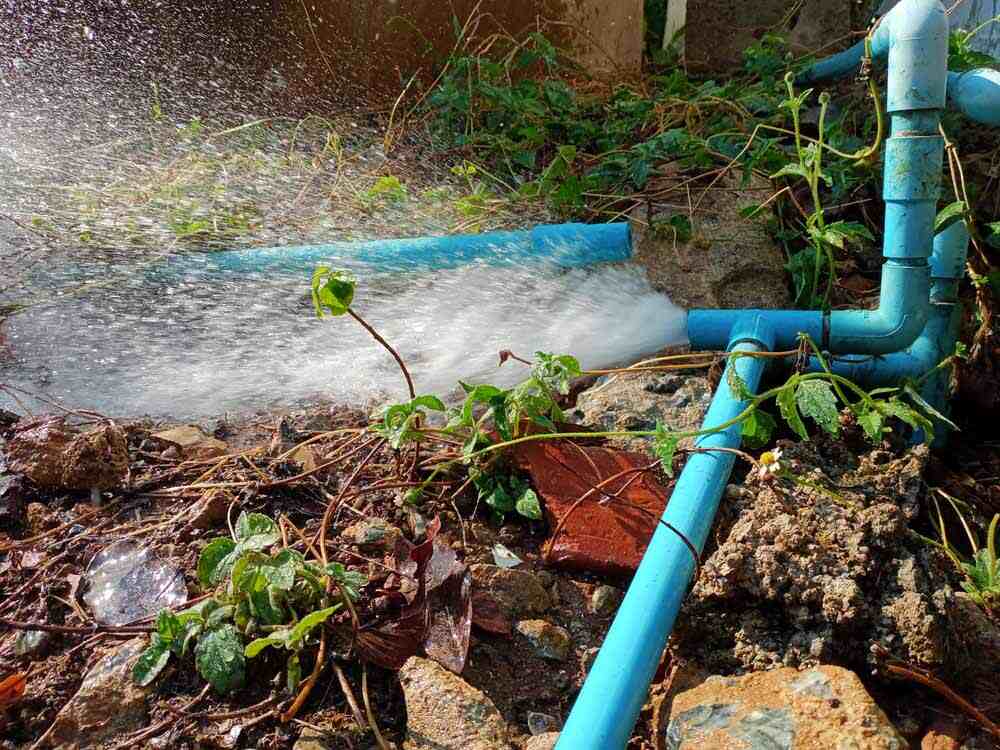 Water gushing out of a damaged water line