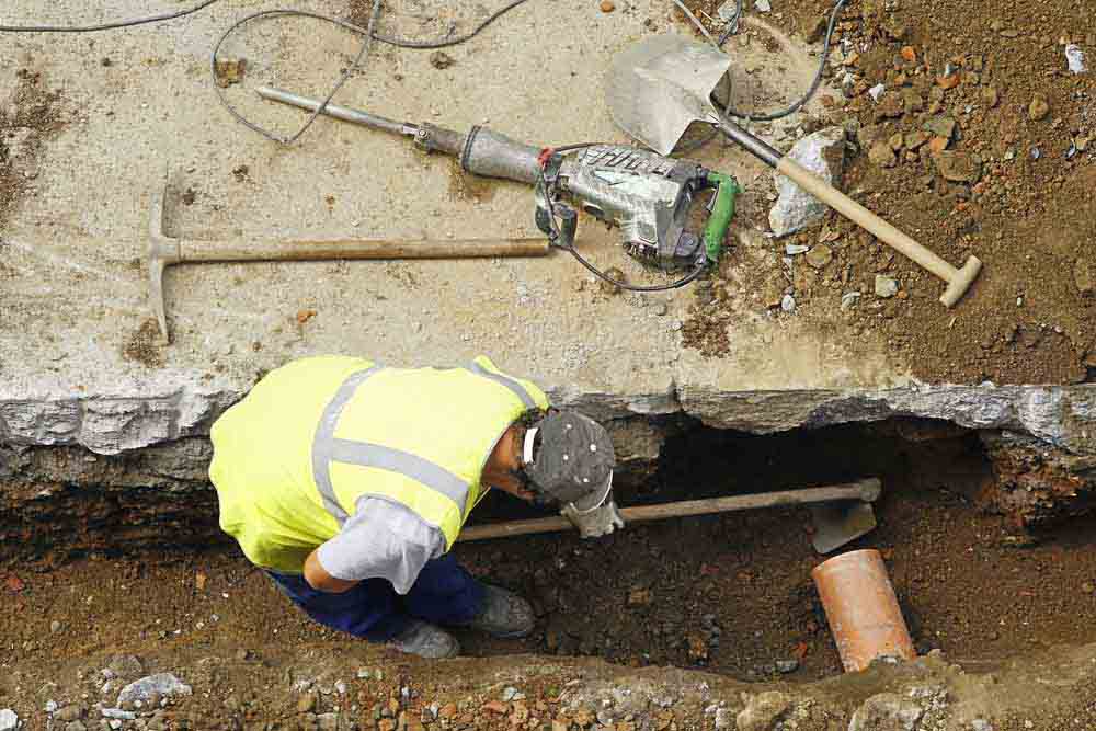 Damaged sewer line being repaired